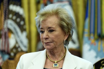 Education Secretary Linda McMahon listens as President Donald Trump speaks with reporters as he signs an executive order in the Oval Office of the White House, April 23, 2025, in Washington.