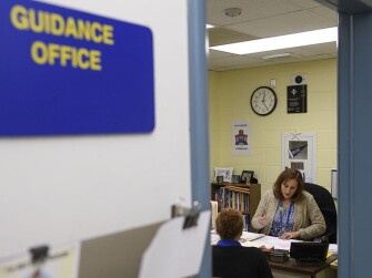 Emilia Peiffer talks to a senior in her office in North Versailles, Pa.