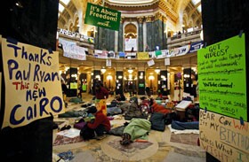 Opponents of Wisconsin Gov. Scott Walker’s bill to curb collective bargaining rights for many state workers, including teachers, sleep on the floor of the rotunda at the state Capitol in Madison last week.