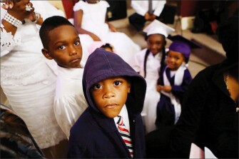 Jaquin Nelson, 6, wears a hooded sweatshirt during a Sunday church service in New Orleans in July. Congregants wore hooded sweatshirts in response to the fatal shooting of Florida teenager Trayvon Martin.