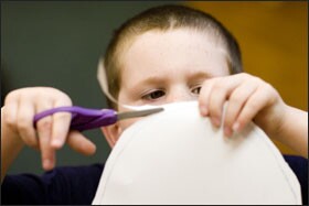 Jesse Erickson, 4, practices with scissors at the Tillicum Head Start program, in Tillicum, Wash. The pioneering federal program is up for reauthorization.