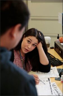 Roxana Cruz, an adviser fellow with National College Advising Corps, advises junior Oscar Ramos at the College and Career Center at Tennyson High School in Hayward, Calif., on January 8.