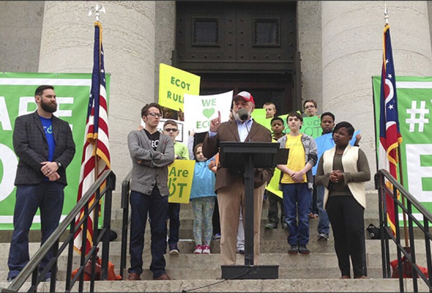 William Lager, center, founder of Ohio's largest online charter school, the Electronic Classroom of Tomorrow (ECOT), speaks to hundreds of supporters on May 9 during a rally outside the Statehouse in Columbus, Ohio.