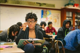 Jasmine Curtis, a sophomore at Lindblom, listens during a geometry lesson.