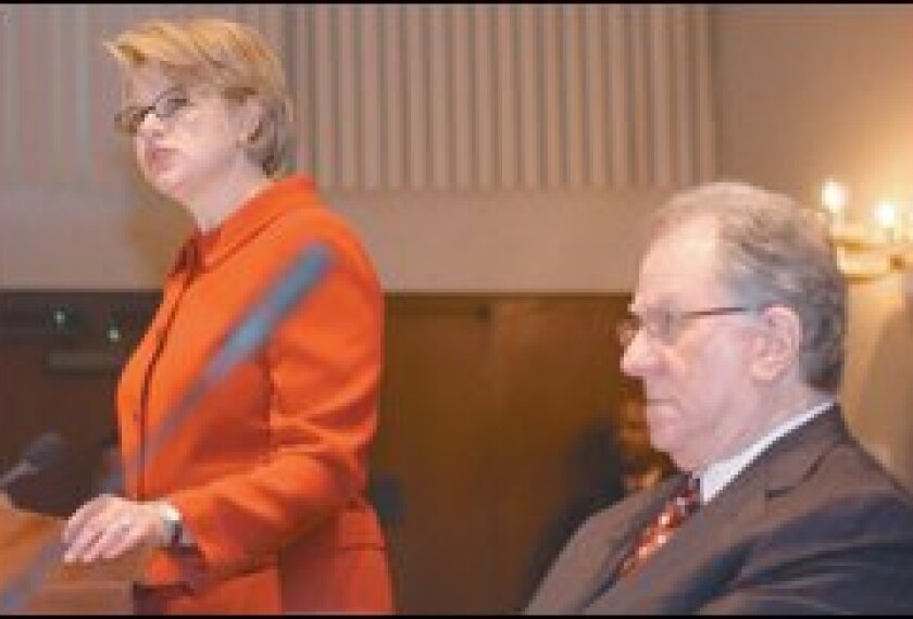 Secretary of Education Margaret Spellings addresses the first meeting of her Commission on the Future of Higher Education last October, as panel Chairman Charles Miller listens.