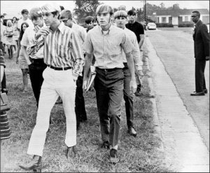The first white students to attend West Charlotte High School are directed to classes by Assistant Principal Leroy Miller in Charlotte, N.C., on Sept. 9, 1970, as Charlotte-Mecklenburg County schools open under a court-ordered desegregation plan.