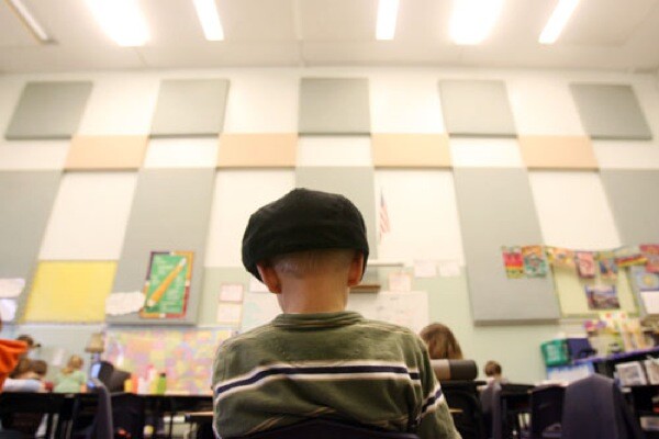 Fifth grader Preston Southard reads in a classroom at Anser Charter School in Boise, Idaho, whose lofty ceilings are relics of the building's former life as an athletic club. The 188-student school shares the facility with Bronco Elite Gymnastics.