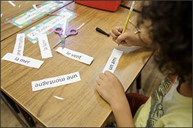 Second grader Bodhi Weatherford, 7, reviews vocabulary during a French class at the Franklin International Language Academy in Glendale, Calif. Since 2002, the Glendale district has given special recognition to students who demonstrate biliteracy.