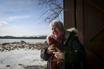 Pioneer Valley Regional School District Interim Superintendent Patricia Kinsella holds one of her chickens on her farm in Northfield, Mass., on January 14, 2022.