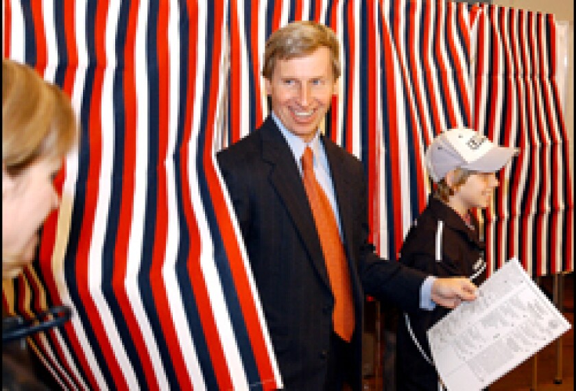 New Hampshire Democratic gubernatorial candidate John Lynch of Hopkinton, N.H., looks toward his wife, Susan, left, as he leaves the voting booth with his son, Hayden, after voting in Hopkinton Town Hall Tuesday, Nov. 2, 2004.