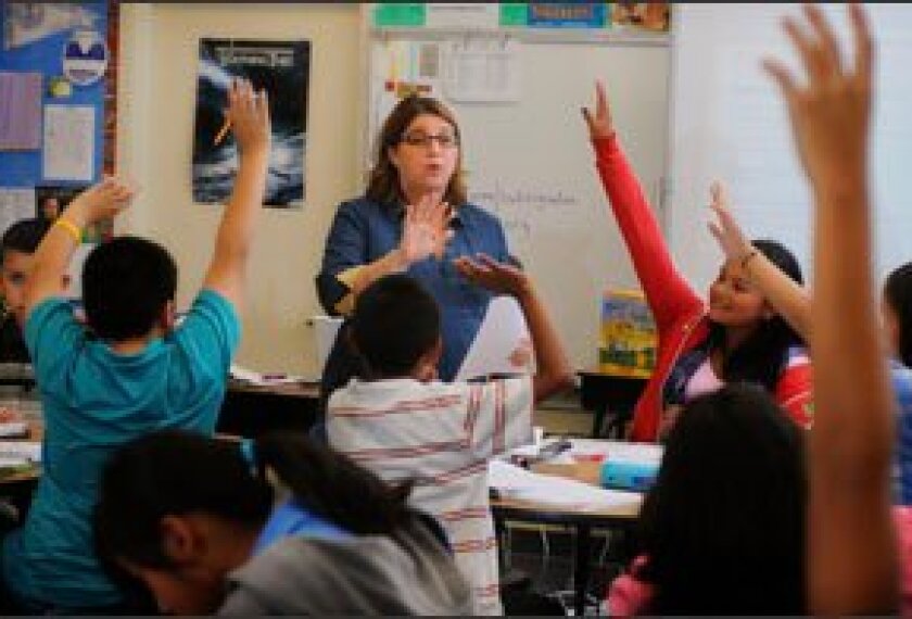Heather Wolpert-Gawron, a language arts teacher, works with her 7th graders at Jefferson Middle School.