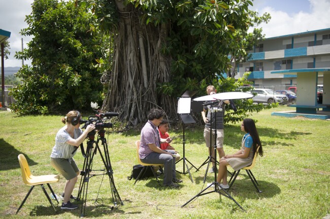 Assistant Editor Andrew Ujifusa interviews a student in Puerto Rico.