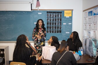 Students in the cosmetology class speak with CTE Executive Director, Angela Mike, during their class at Westinghouse High School in Pittsburgh, Pa., on Dec. 13, 2022.