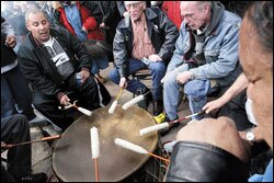 Members of various Indian tribes honor the victims of the Red Lake shootings at a March 23 ceremony at the State Capitol.