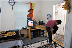 Oscar changes for his evening job as a waiter in Putnam County, N.Y. He says that earning a GED in Spanish has allowed him to move on to community college.