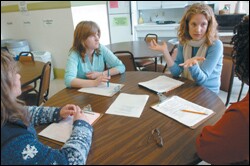 Amanda Asdel, third from left, leads a group of Glen Park teachers in a "debriefing" after an observation of a 5th grade class at the school.