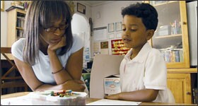 In the film “Waiting For ‘Superman,’” Maria helps her son, Francisco, with homework. He is vying for one of 40 open spots in a Harlem charter school.