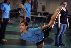 Student Angelli Agustin practices some moves during class at Harmony Magnet. Students like Agustin, who is enrolled in the performing arts pathway, undergo mock interviews with a panel of local professionals in the field.