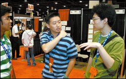 June-Ho Kim, center, talks with other finalists Abhiram Bhashyam, left, and Michael Mi, at an international science competition staged by Intel in Phoenix this month.