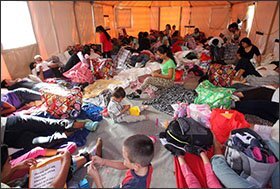 Central American mothers and their children rest on the floor of a portable tent at the Humanitarian Respite Center in McAllen, Texas, last week.