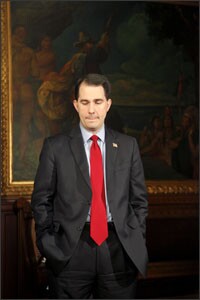 Gov. Walker prepares for a fireside speech at the state Capitol last week. The governor, who has been the target of massive protests, insists that curtailing public employees’ rights is crucial to the state’s fiscal future.