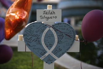 Jailah Silguero's cross stands at a memorial site for the victims killed in this week's shooting at Robb Elementary School in Uvalde, Texas, Friday, May 27, 2022.