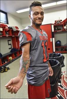 Football player Chris Spencer, a senior at Hurley, shows off his Confederate flag tattoo. “It doesn’t mean racism to me,” he told USA Today. “I just look at it as a flag. It’s our mascot. It just means our school.”