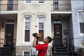 Mikel walks to baseball practice after school. He plays football, basketball, and baseball.