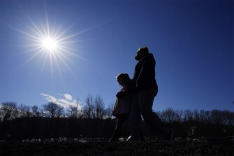 Kacie Thompson, left, 9, walks with her mother, Melissa Weirich, after visiting the former home of Kacie's friend, Ava Lerario on March 11, 2021, in Lansford, Pa.