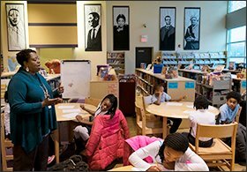 Media specialist Gwendolyn Shipps leads a reading and writing class at Barack Obama Elementary School in Normandy, Mo. While the school and its famous name have brought pride and optimism to the impoverished community, the school struggles to raise achievement and hold onto educators.