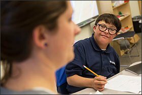 Pablito Montoya pays close attention to teacher Sarah Bowman as she leads instruction for students at STRIVE Prep-Federal last month.