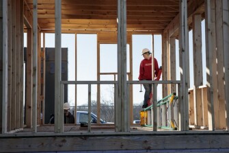 Sophomore Seairra Ferguson, 16, begins construction work for the day on a tiny house on Friday, March 22, 2019 at Battle High School in Columbia, Mo. Students in a combined construction and geometry class are building a tiny house for a low-income family in the community.