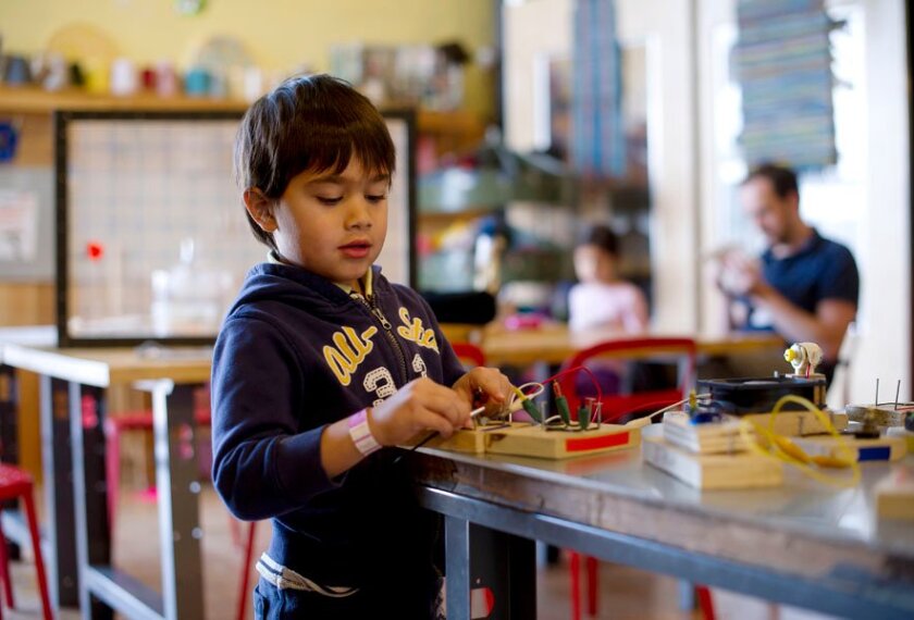 Abdullah Haseeb, 4, works with “circuit blocks” in the MakeShop at the Pittsburgh Children’s Museum. The blocks are the result of a collaboration between a local teacher, a resident artist, and a robotics lab at Carnegie Mellon University.