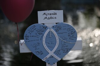 Maranda Mathis' cross stands at a memorial site for the victims killed in this week's shooting at Robb Elementary School in Uvalde, Texas, Friday, May 27, 2022.