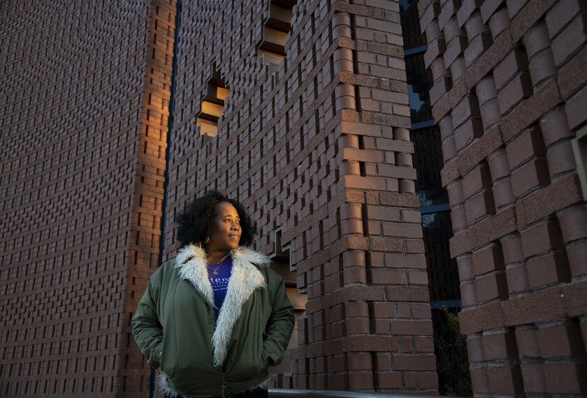 Kahlil Kuykendall, program manager with Crittenton Services of Greater Washington, stands for a portrait at the Anacostia Community Museum, in Washington D.C., on Dec. 8, 2020.
