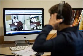 Elizabeth Self, a doctoral student at Vanderbilt University, monitors a clinical simulation that she designed to help preservice teachers develop cultural sensitivity. As part of the simulations, education students work with actors who play the roles of students or parents. The interactions are recorded and can be viewed in real time from another room.