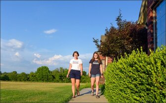 Jennifer Esau, an Oklahoma teacher who is running for a state Senate seat, in Claremore, Okla., leaves a house with her daughter Isabelle as they canvass her district for votes.