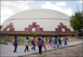 Students walk between buildings at the Little Singer Community School in Birdsprings, Ariz., on the Navajo Nation. The school is run by the federal Bureau of Indian Education, a long-troubled agency that the Obama administration has pledged to reorganize as part of a strategy to improve educational outcomes for Native American children.