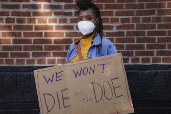 Teachers and staff protest outside Franklin D. Roosevelt High School in New York Oct. 2, calling for more and better COVID-19 testing and precautions. Teacher retirements are actually down this year in the city despite the pandemic.