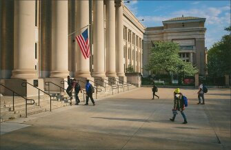 Students enter Lindblom Math & Science Academy at the start of the day earlier this month. The landmark building, which was built in 1917, is located in Englewood, a on Chicago’s South Side.