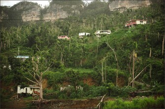 Lingering damage from Hurricane Maria is still evident on a hillside in Ciales, Puerto Rico.