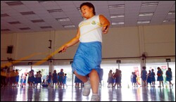 Mona Slow plays sports during her lunch break. Because she is overweight, the 10-year-old must take part in her Singapore primary school's "health club."