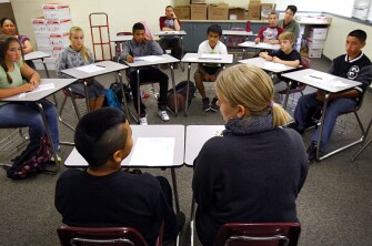 Danny Perez, a 7th grader at Davidson Middle School in San Rafael, Calif., faces a court of his peers for getting involved in a fight. Kristy Treewater, the school’s assistant principal, sits by his side to monitor the student-run session.