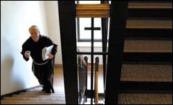 The Rev. Gary Wegner, the director of spiritual life at St. Lawrence, heads to class.