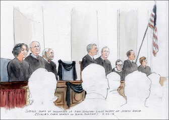 Justices stand on Feb. 22 at the beginning of the first U.S. Supreme Court session following Justice Antonin Scalia's death on Feb. 13. Black bunting adorns the bench and Scalia's chair.