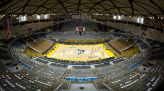 Pleasant Hill and Hicks High School play the boys’ state championship Class C game in a largely empty Burton Coliseum in Lake Charles, La., March 13, 2020. Fans were banned from the arena to conform with a state mandate prohibiting large gatherings of people.