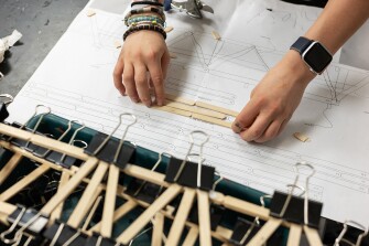 As part of the middle school science class, students work on building bridges on March 30, 2023.