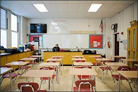 Park Ridge high school physics teacher Golda Steiner sits in an empty classroom checking on her students’ progress during the school district’s first “Virtual Day,” which gave students in grades 7-12 the option on Feb. 8 to use school-issued laptops to work from home.