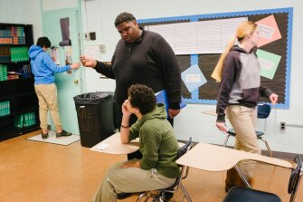 Chrissell Rhone speaks with Gage Harrison, a student at the Picayune Center for Alternative Education in Picayune, Miss. After teaching for 10 years in a school system with an ample supply of black teachers, Rhone is now the only African-American teacher in his workplace.