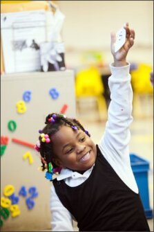 Kindergartner Alana Sellers raisers her hand during a phonics lesson at Detroit International Academy for Young Women. A new study finds that the students who are most likely to benefit from single-sex schools are females who prefer an all-girls learning environment.